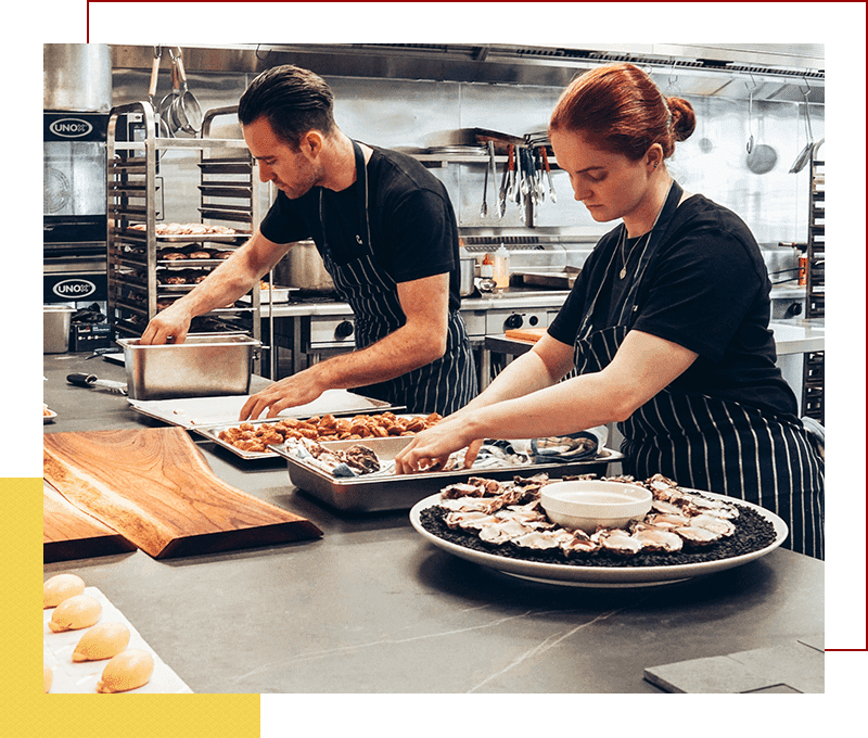 Food being prepared by restaurant cooks